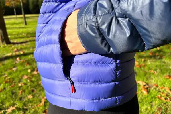 A person putting their hand in the pocket of the Cotopaxi Women