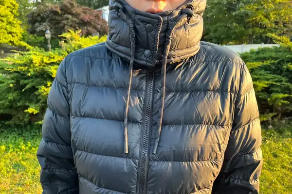 A close-up of a person wearing the Lole Claudia Down Jacket outdoors