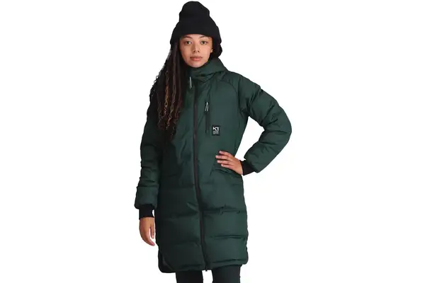 A person wearing the Lole Claudia Down Jacket with patterned leggings outdoors