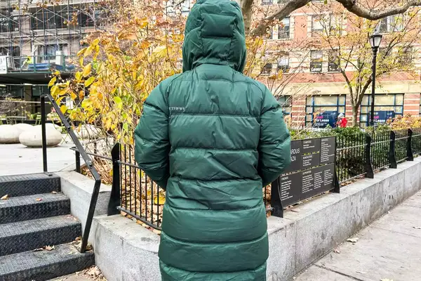 Back view of a person wearing a Kari Traa Rongve Parka standing in a city park