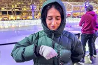 A person zips a pocket on a Kari Traa Rongve Parka