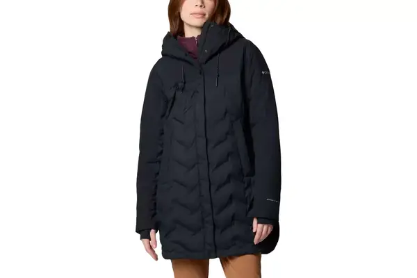 A close-up of a person wearing the Lole Claudia Down Jacket with the hood up