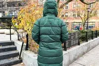 Back view of a person wearing a Kari Traa Rongve Parka standing in a city park