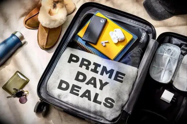 Luggage packed with items including a blanket labeled 