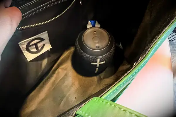 The Ultimate Ears Wonderboom 3 attached to a backpack