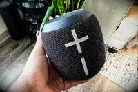 A person holds up the Ultimate Ears Wonderboom 3