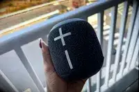 A person holds up the Ultimate Ears Wonderboom 3