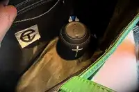 The Ultimate Ears Wonderboom 3 attached to a backpack