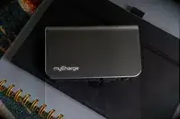 The myCharge Fast Charging Portable Charger on a notebook