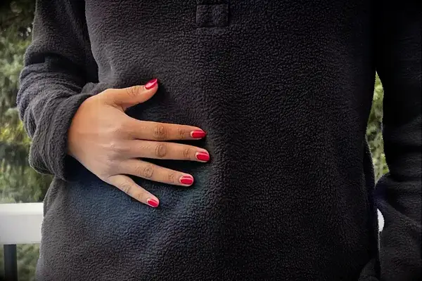 Persons hand on a Wild Rye Danner High-Pile Fleece Pullover