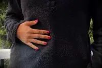 Persons hand on a Wild Rye Danner High-Pile Fleece Pullover