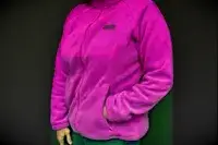 Person with their hand in the pocket of a Columbia Women