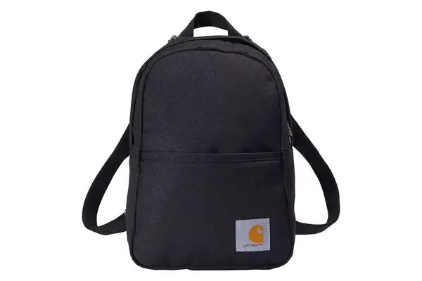 A person opens the pocket on the Cotopaxi Allpa 42L Travel Pack