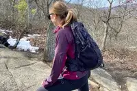 Person hiking outside with the Gregory Women