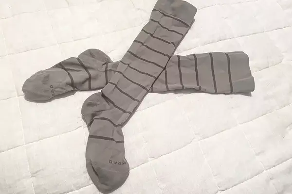 Comrad Knee High Compression Socks On Bedspread
