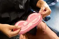 A person holding the Slip Lovely Lashes Contour Sleep Mask