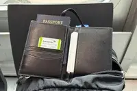Passports and documents inside the Quince Nappa Leather RFID Blocking Passport Holder