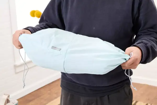 Hands holding a bagsmart compression packing cubes