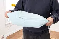 Hands holding a bagsmart compression packing cubes