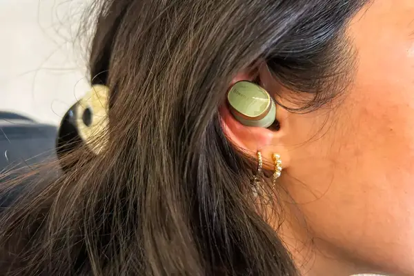 Bowers & Wilkins Pi8 Headphones in someone