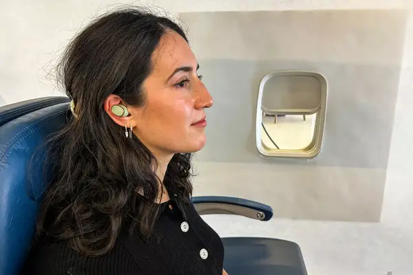 Bowers & Wilkins Pi8 Headphones on an airplane