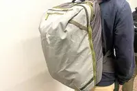 A person carries a Cotopaxi Allpa 42L Travel Pack on their back