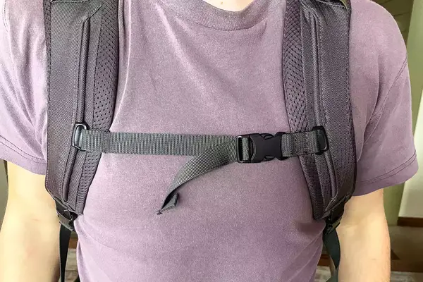 Close-up of a person wearing a Cotopaxi Allpa 42L Travel Pack