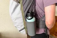 View of the side water bottle pocket on a Cotopaxi Allpa 42L Travel Pack