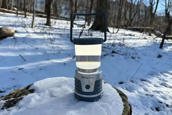 Ultimate Survival Technologies 30-Day Duro Lantern outside on snowy rock