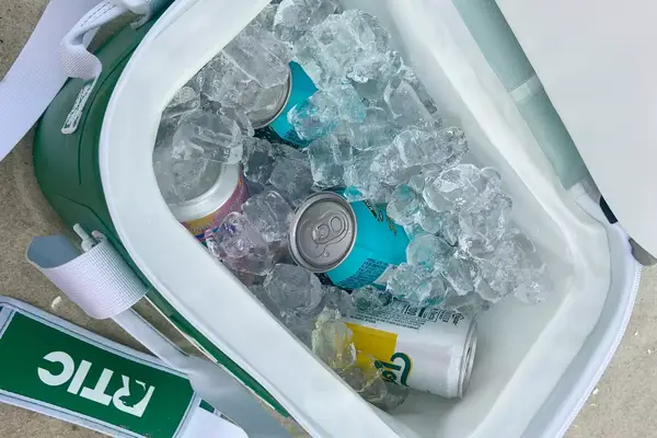 Ice and canned beverages inside the RTIC Insulated Soft Cooler Bag