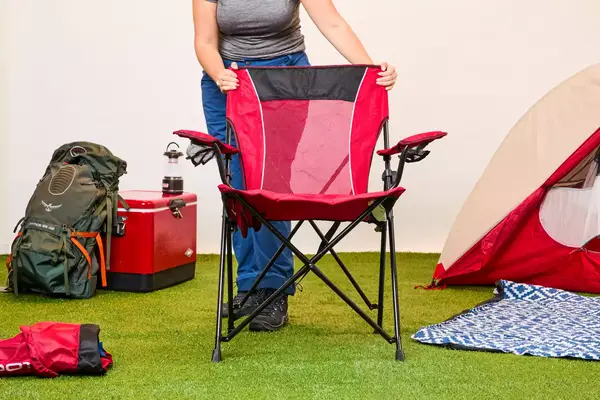 Someone holding the Kijaro Dual Lock Camping Chair
