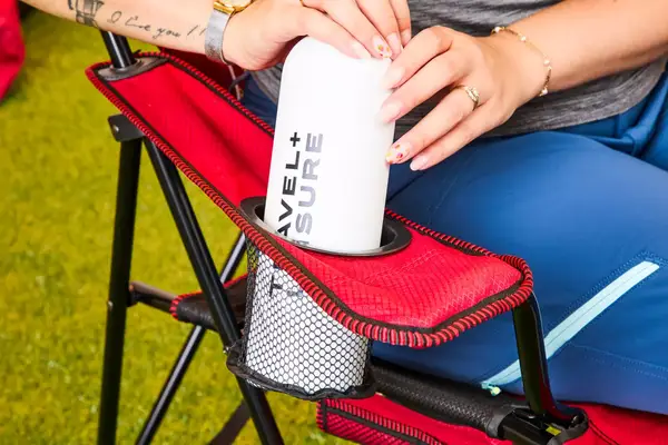 Someone sits in the Kijaro Dual Lock Camping Chair