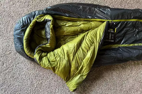 The Nemo Coda Genderless Endless Promise Down Mummy Sleeping Bag folded over exposing the inside