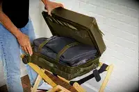 A person opening a packed Dagne Doverr Seattle Carry On Rolling Luggage 20.5