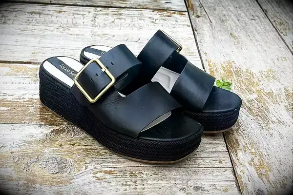 Franco Sarto Taziana Espadrille Slide Sandals on a wood background