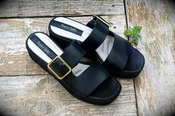 Franco Sarto Taziana Espadrille Slide Sandals on a wood background