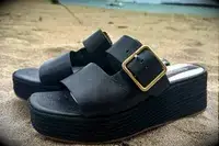 Side view of the Franco Sarto Taziana Espadrille Slide Sandals on the sand