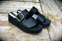 Franco Sarto Taziana Espadrille Slide Sandals on a wood background