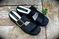 Franco Sarto Taziana Espadrille Slide Sandals on a wood background