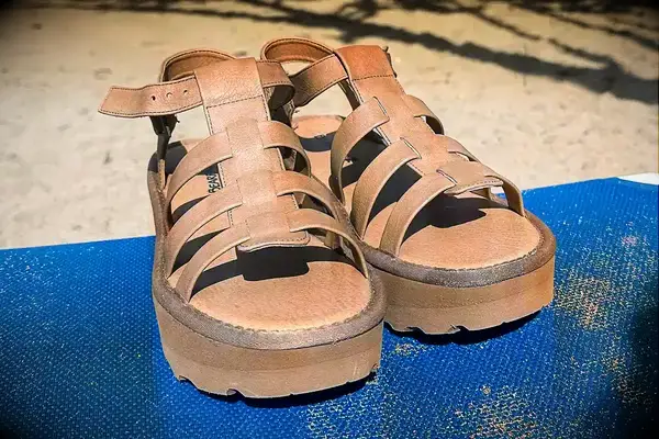 Bear Paw High Seas Iced Coffee Sandals on the sand a a blue towel