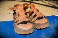 Bear Paw High Seas Iced Coffee Sandals on the sand a a blue towel