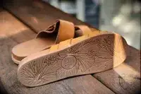 Reef Cushion Vera Cruz Slides displayed on a wood surface