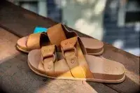 Reef Cushion Vera Cruz Slides displayed on a wood surface