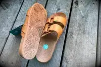 Reef Cushion Vera Cruz Slide one shoe upside down and the other right side up