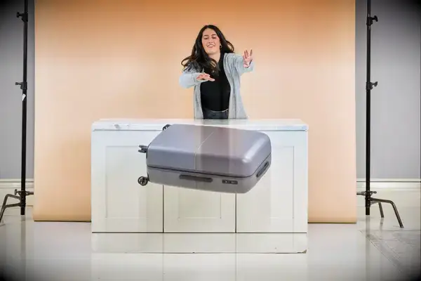 A person throwing July Checked Plus Light