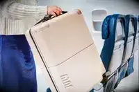 Person lifting the July Carry On