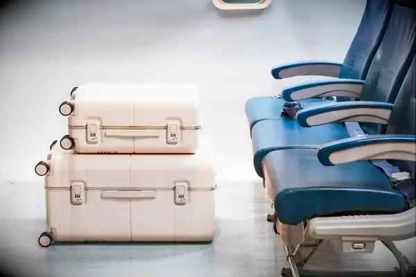 The July Trunk Set in front of airplane seats