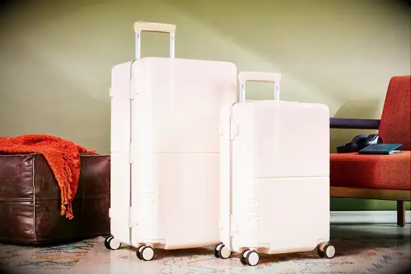 July Trunk Set in front of a green wall near ottoman and chair