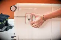 Hand touches the lock on a July Trunk Set piece