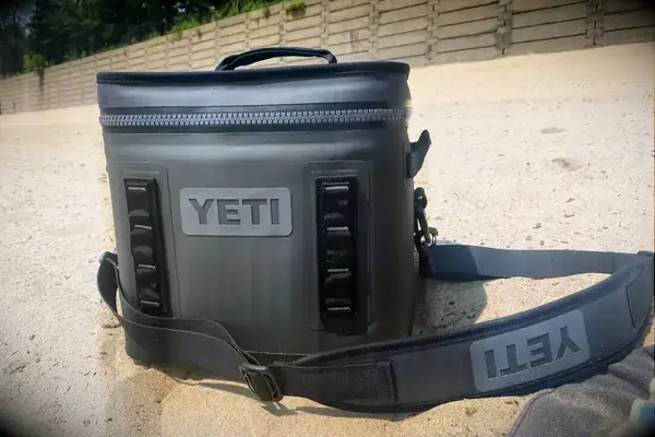 A Yeti Hopper Flip 12 Soft Cooler sitting on the beach